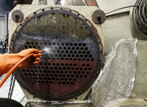 Industrial equipment cleaning with high pressure jetting